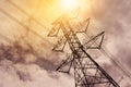 High voltage pole with dark sky and clouds background. Royalty Free Stock Photo