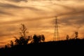 High voltage pole with golden sky