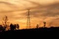 High voltage pole with golden sky