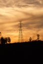 High voltage pole with golden sky