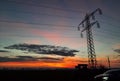 High voltage pole on sunset - country road Royalty Free Stock Photo