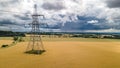 High voltage post across the farm land Royalty Free Stock Photo