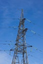 High voltage post. High-voltage tower sky background. Royalty Free Stock Photo