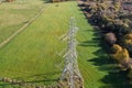 High voltage post,High voltage tower sky field grass housing esate aerial drone view Royalty Free Stock Photo