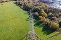 High voltage post,High voltage tower sky field grass housing esate aerial drone view Royalty Free Stock Photo