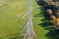 High voltage post,High voltage tower sky field grass housing esate aerial drone view Royalty Free Stock Photo