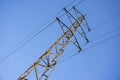 High voltage power grid pylon against blue sky Royalty Free Stock Photo