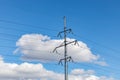 High-voltage power line against the background of clouds and blue sky. Royalty Free Stock Photo