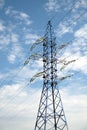 High-voltage power line and blue color metal prop with many electrical wires vertical view Royalty Free Stock Photo