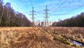 High-voltage power line in the field Royalty Free Stock Photo