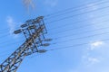 High-voltage power line 110 kV, metal support, wires, insulators, against the blue sky Royalty Free Stock Photo