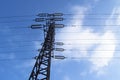 High-voltage power line 110 kV, metal support, wires, insulators, against the blue sky Royalty Free Stock Photo