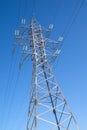 High-voltage power line metal prop over blue sky Royalty Free Stock Photo