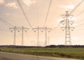High voltage power line in sun-set landscape. Royalty Free Stock Photo