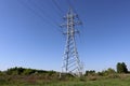 High voltage power line support against blue sky background. Electrical industry Royalty Free Stock Photo