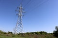 High voltage power line support against blue sky background. Electrical industry Royalty Free Stock Photo