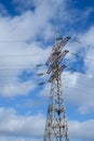 High voltage power line. View of the metal support of the power transmission line against the background of the blue sky Royalty Free Stock Photo