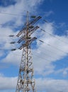 High voltage power line. View of the metal support of the power transmission line against the background of the blue sky Royalty Free Stock Photo