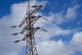 High voltage power line. View of the metal support of the power transmission line against the background of the blue sky Royalty Free Stock Photo