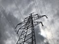 High voltage power lines on background of sky. Towers power lines against a cloudy sky background. Electricity transmission pylons Royalty Free Stock Photo