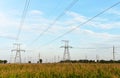 High voltage power lines on blue sky background. Electric transmission pylon tower. Wire electrical energy. Electricity concept Royalty Free Stock Photo