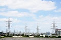 High voltage power lines with electricity pylons at blue sky. Royalty Free Stock Photo