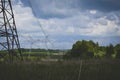 High-voltage power lines on the field. Royalty Free Stock Photo