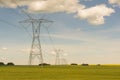 High Voltage Power Lines in Field Royalty Free Stock Photo