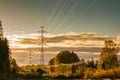 High-voltage power lines at golden sunset at autumn in Finland Royalty Free Stock Photo