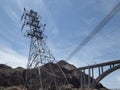 High Voltage Power Lines intersect at a large metal Utility poles Royalty Free Stock Photo