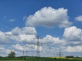 High voltage power lines in the natural rural landscape Royalty Free Stock Photo