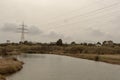 High voltage power lines over the river Royalty Free Stock Photo