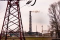 high-voltage power lines and smoky pipes of the metallurgical plant.