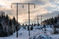 High voltage power lines in a sunny winter land in Sweden Royalty Free Stock Photo