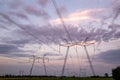 High-voltage power lines at sunset. High voltage electric transmission tower Royalty Free Stock Photo