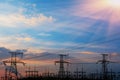 High-voltage power lines at sunset. electricity distribution station. high voltage electric transmission tower.