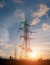 High-voltage power lines at sunset. electricity distribution station. high voltage electric transmission tower. Royalty Free Stock Photo