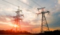 High-voltage power lines at sunset or sunrise. High voltage electric transmission tower