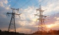 High-voltage power lines at sunset or sunrise. High voltage electric transmission tower