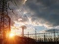 High voltage power lines at sunset. Thermal power plant. High-voltage transformer substation Royalty Free Stock Photo