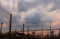 High voltage power lines at sunset. Thermal power plant. High-voltage transformer substation Royalty Free Stock Photo