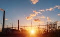 High voltage power lines at sunset. Thermal power plant. High-voltage transformer substation Royalty Free Stock Photo