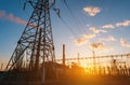 High voltage power lines at sunset. Thermal power plant. High-voltage transformer substation Royalty Free Stock Photo