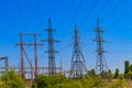 High voltage power lines towers on blue sky background Royalty Free Stock Photo