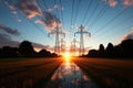 High voltage power lines transmit energy over a sunrise horizon