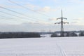 High voltage power lines in a winter landscape. High voltage pole. Royalty Free Stock Photo