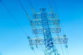 High voltage power pylon against nice blue sky. Energy concept Royalty Free Stock Photo