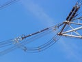 High voltage power pylons against blue sky Royalty Free Stock Photo