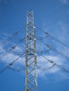 A high voltage power pylons against blue sky Royalty Free Stock Photo