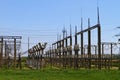 High-voltage electric power station lines and transformer blocks on a blue sky Royalty Free Stock Photo